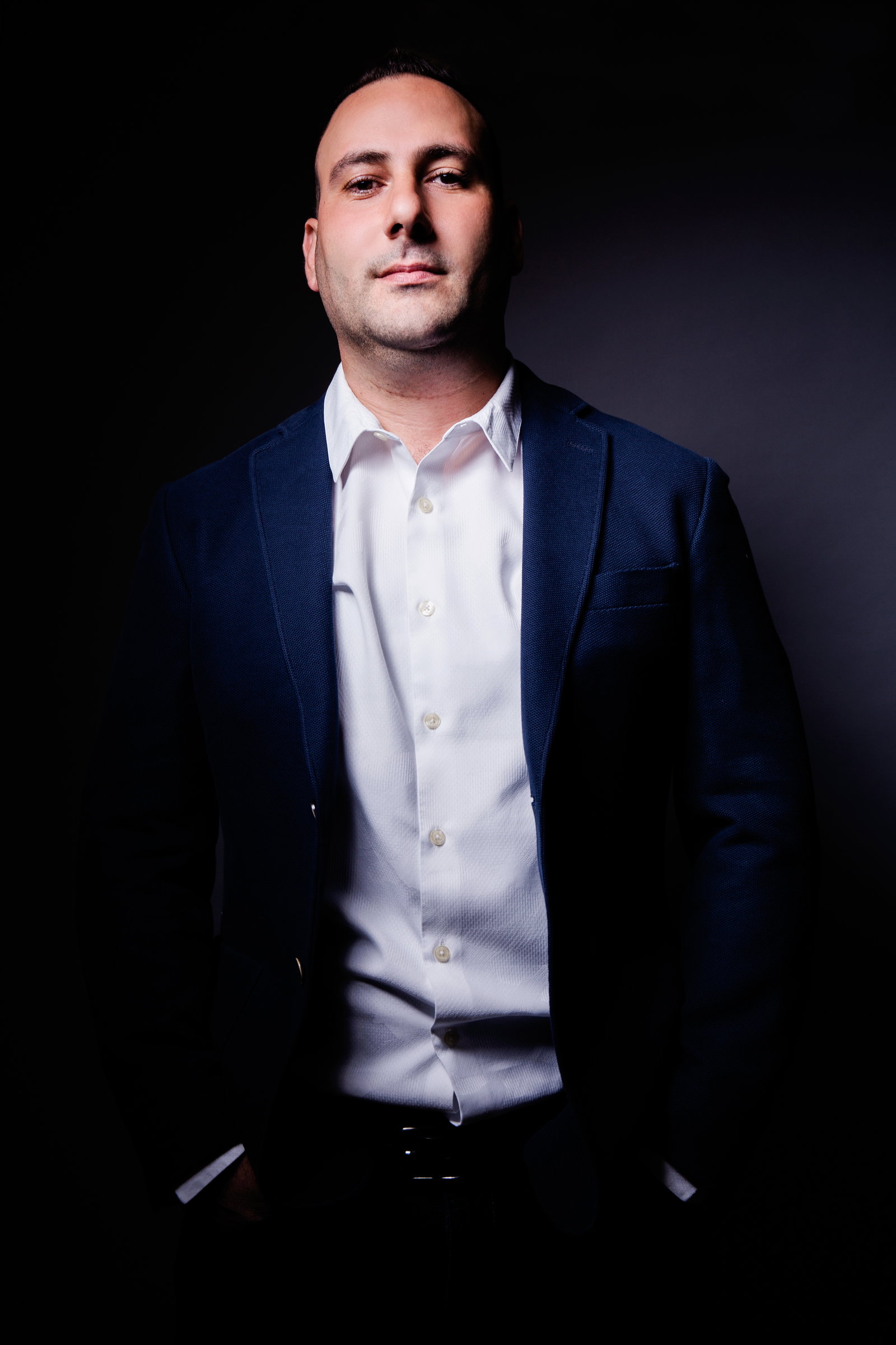 Portrait of Sam Daoud in a dark suit